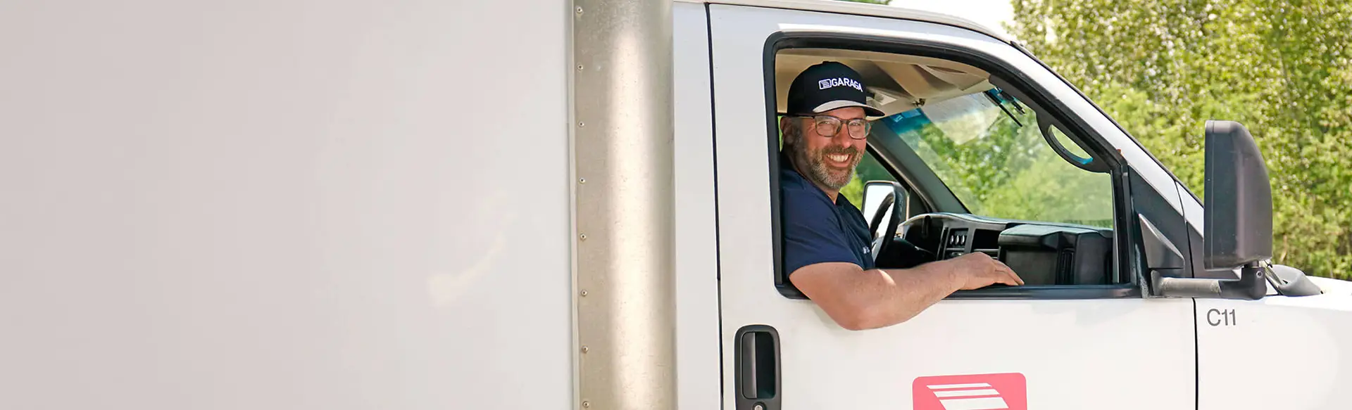 A technician inside a service truck in Sioux City, Iowa, prepared to install a garage door